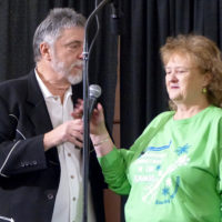 MC Doug Whitely with Lorraine Jordan at the 2021 Bluegrass Christmas in the Smokies - photo by Gary Hatley