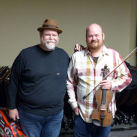 Former bandmates Don Rigsby and Matt Hooper reunite at the 2021 Bluegrass Christmas in the Smokies - photo by Gary Hatley