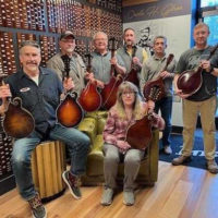 David Harbey and fellow Gibson employees with early mandolins coming to The Acoustic Shoppe on April 9