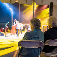 Jean and Del McCoury watch The Travelin' McCourys at DelFest 2022 - photo by J Srausser Visuals