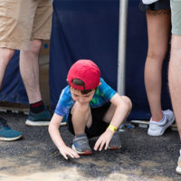 Mud is always fun at DelFest 2022 - photo by Marc Shapiro Media