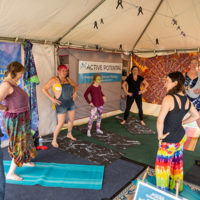 Morning yoga at DelFest 2022 - photo by J Strausser Visuals