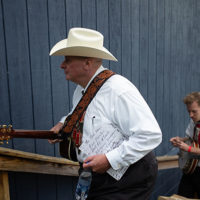 David Peterson and Gabe Dettinger head for the stage at the 50th Dr. Ralph Stanley Hills of Home Memorial Day Bluegrass festival in Coeburn, VA. Friday May27th, 2022 - photo by Jeromie Stephens​
