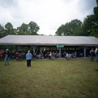 The Ralph and Carter Stanley Pavillion provided shade and shelter from the sun and rain at the 50th Dr. Ralph Stanley Hills of Home Memorial Day Bluegrass festival. Coeburn, VA. Friday May 27th, 2022 - photo by Jeromie Stephens