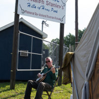 Camp pickin' at the festival entrance. 50th Dr. Ralph Stanley Hills of Home Memorial Day Bluegrass festival. Coeburn, VA. Friday May 27th, 2022 - photo by Jeromie Stephens​