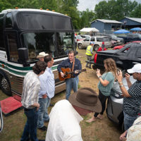 Larry Sparks entertains fans at the front of the bus at the Dr. Ralph Stanley Hills of Home festival 2022 - photo by Jeromie Stephens