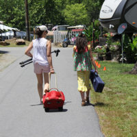 Dreama and Whysper Stephenson head for the stage at the 2022 Cherokee Bluegrass Festival - photo by Laura Tate Photography