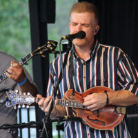 Milom Williams with Backline at the 2022 Cherokee Bluegrass Festival - photo by Laura Tate Photography