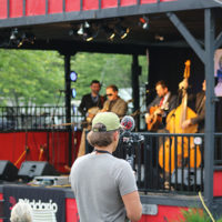 Videographer captures The Larry Stephenson Band at the 2022 Cherokee Bluegrass Festival - photo by Laura Tate Photography
