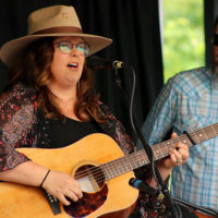 Katelyn Ingardia and Travis Tucker with Backline at the 2022 Cherokee Bluegrass Festival - photo by Laura Tate Photography