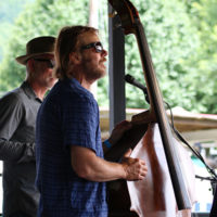 Mike Barber with The Gibson Brothers at the 2022 Cherokee Bluegrass Festival - photo by Laura Tate Photography
