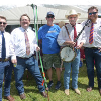 Camp Springs' promoter, Cody Johnson, with Terry Baucom's Dukes of Drive at the 2022 Willow Oak Bluegrass Festival - photo by Gary Hatley