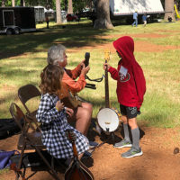 Tuning help at the 2022 CBA Music Camp