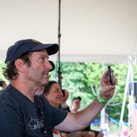 David Sussman - NY City area's most famous bluegrass fan and show video recorder in his element at the 2022 Grey Fox Bluegrass Festival - photo © Tara Linhardt