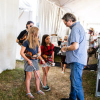 Jerry Douglas signs autographs at the 2022 Grey Fox Bluegrass Festival - photo © Tara Linhardt