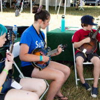 New mandolin players coming along nicely at the 2022 Grey Fox Bluegrass Festival - photo © Tara Linhardt