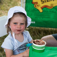 Young festivarian enjoying an ice cream break at the 2022 Grey Fox Bluegrass Festival - photo © Tara Linhardt