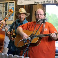 Pine Mountain Bluegrass Band’s Ken Bearden, Mickey Dooley, and Allen Tolbert at the August '22 Bluegrass Jamboree - photo by Kristin Yarbrough