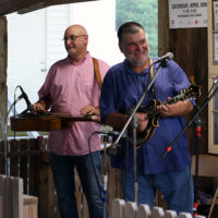 Another Town’s Damion Kidd on dobro and Stacy Richardson on mandolin at the August '22 Bluegrass Jamboree - photo by Kristin Yarbrough