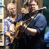 Another Town’s Russell Rollo on bass and Adam Duke on guitar at the August '22 Bluegrass Jamboree - photo by Kristin Yarbrough