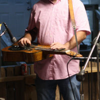 Another Town’s Damion Kidd on dobro at the August '22 Bluegrass Jamboree - photo by Kristin Yarbrough