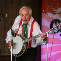 Little Roy Lewis at the summer 2022 Gettysburg Bluegrass Festival - photo by Frank Baker