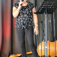 MC Sherry Boyd at the McDowell County Roundup (8/12/22) - photo by Laura Tate Photography