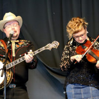 Jereme Brown and Laura Orshaw with The Po' Ramblin' Boys at the 2022 North Carolina State Bluegrass Festival - photo by Laura Tate Photography
