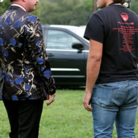 C.J. Lewandowski chats with a fan at the 2022 North Carolina State Bluegrass Festival - photo by Laura Tate Photography