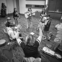 Kimber Ludiker leads the Kids on Bluegrass All Stars in rehearsal at World of Bluegrass 2022 (9/28/22) - photo © Jeromie Stephens