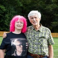Barb Deiderich (with Tom Gray t shirt) and Tom Gray at the founders celebration for Bluegrass Country (9/10/22) - photo © Tara Linhardt