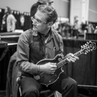 Merl Johnson checking out mandolin in the Exhibit Hall at the World of Bluegrass (9/29/22) - photo © Jeromie Stephens
