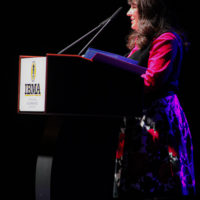 Ruth McLain talks about the IBMA Foundation at the 2022 IBMA Industry Awards luncheon - photo © Frank Baker