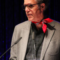 Chris Jones accepts his Broadcaster of the Year award at the 2022 IBMA Industry Awards luncheon - photo © Frank Baker