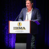 Ronnie Bowman accepts his Songwriter of the Year award at the 2022 IBMA Industry Awards luncheon - photo © Frank Baker