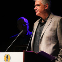 Steve Huber accepts his Distinguished Achievement award at the 2022 IBMA Industry Awards luncheon - photo © Frank Baker