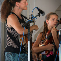 Tara Linhardt leads the Kids Academy performance at the 2022 Delaware Valley Bluegrass Festival - photo by Frank Baker