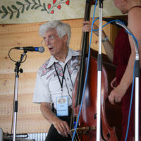 Tom Gray with Valerie Smith at the 2022 Delaware Valley Bluegrass Festival - photo by Frank Baker
