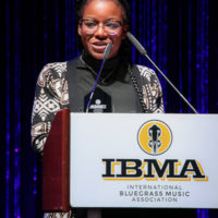 Million Werbin accepts her 2022 IBMA Momentum Industry Involvement Award - photo © Frank Baker
