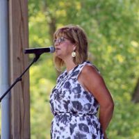 MC Cindy Baucom at the 2022 Camp Springs Bluegrass Festival - photo by Laura Tate Photography