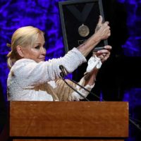 Lorrie Morgan accepts Country Music Hall of Fame and Museum induction on behalf of Keith Whitley, presented at the class of 2022 Medallion Ceremony at Country Music Hall of Fame and Museum on October 16, 2022 in Nashville, Tennessee. (Photo by Terry Wyatt/Getty Images for Country Music Hall of Fame and Museum)