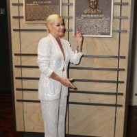 Lorrie Morgan poses with plaque honoring inductee Keith Whitley at the class of 2022 Medallion Ceremony at Country Music Hall of Fame and Museum on October 16, 2022 in Nashville, Tennessee. (Photo by Jason Kempin/Getty Images for Country Music Hall of Fame and Museum)