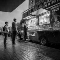 Food trucks in the street - in the rain - at IBMA Bluegrass Live! - photo © Jeromie Stephens