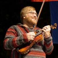 Adam Haynes with The Grascals at the 2022 Oklahoma International Bluegrass Festival - photo by Pamm Tucker