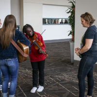 Kimber Ludiker oversees a youth group at the 2022 IBMA World of Bluegrass - photo © Frank Baker