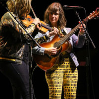 Kimber Ludiker and Avril Smith with Della Mae at the IBMA Bluegrass Live! festival (10/1/22) - photo © Frank Baker