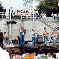 Tommy Cordell with The Laurel Mountain Boys at the River Regatta in Charleston, WV 1978 or 1979 - photo credit Kim Johnson. L-R Tommy, Don Sowards, Paul Adkins, Mark Sowards - hidden, Rob Ward bass