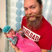 Wayne Brewer with his new born daughter, Alayna