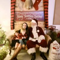 Caleb Bailey's girlfriend Christine Hostetter, Colt Bailey and Aniyah Grace with Santa at the 2022 Merry Mountain Christmas in Grottoes, VA