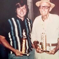 George Portz with his grandfather, Perry Biggs and their trophies